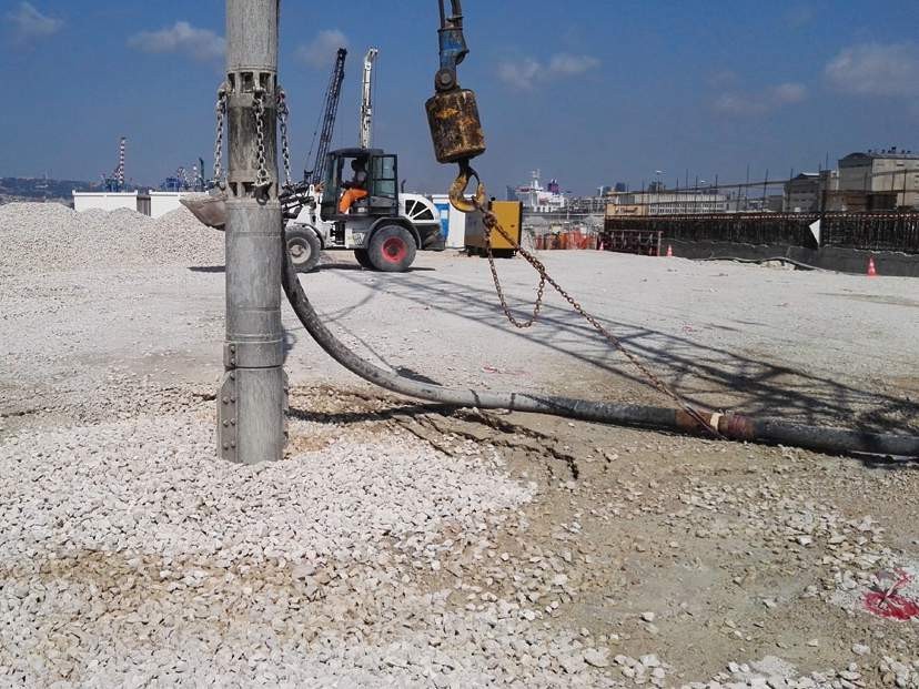 Bottom feed stone column — crane-suspended VibroSTA with hopper