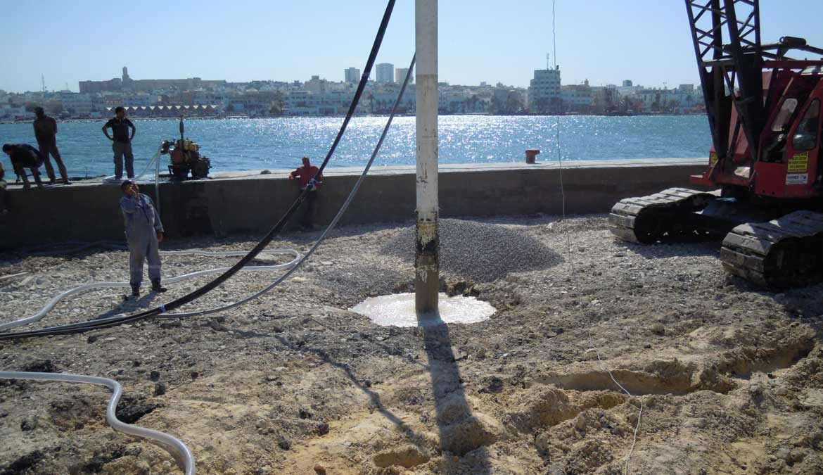 Stone column installation — wet top-feed vibro replacement at waterfront
